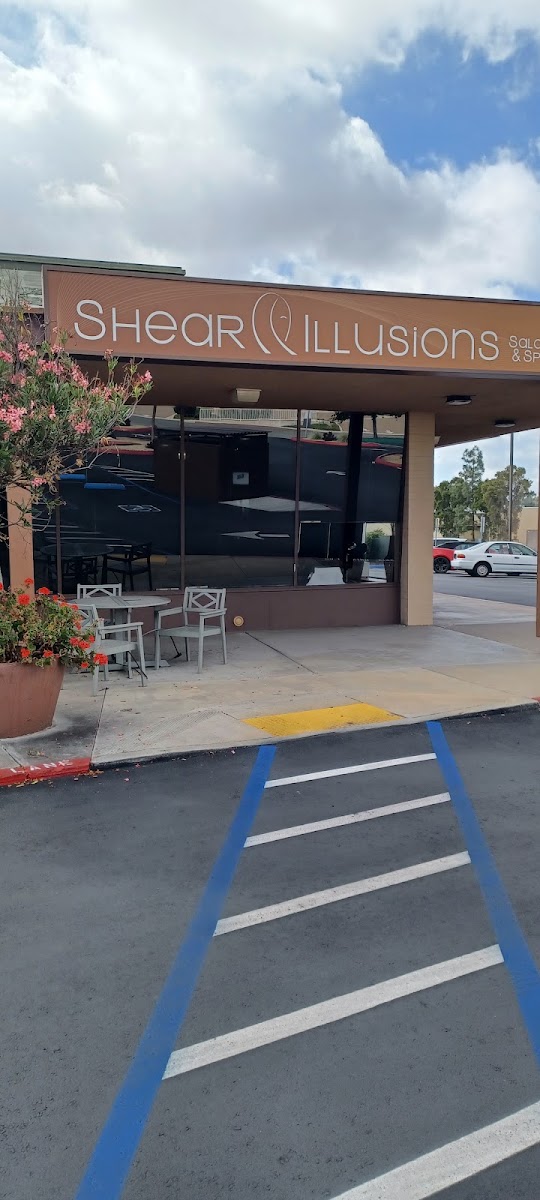 Patio seating outside Shear Illusions on Center Dr